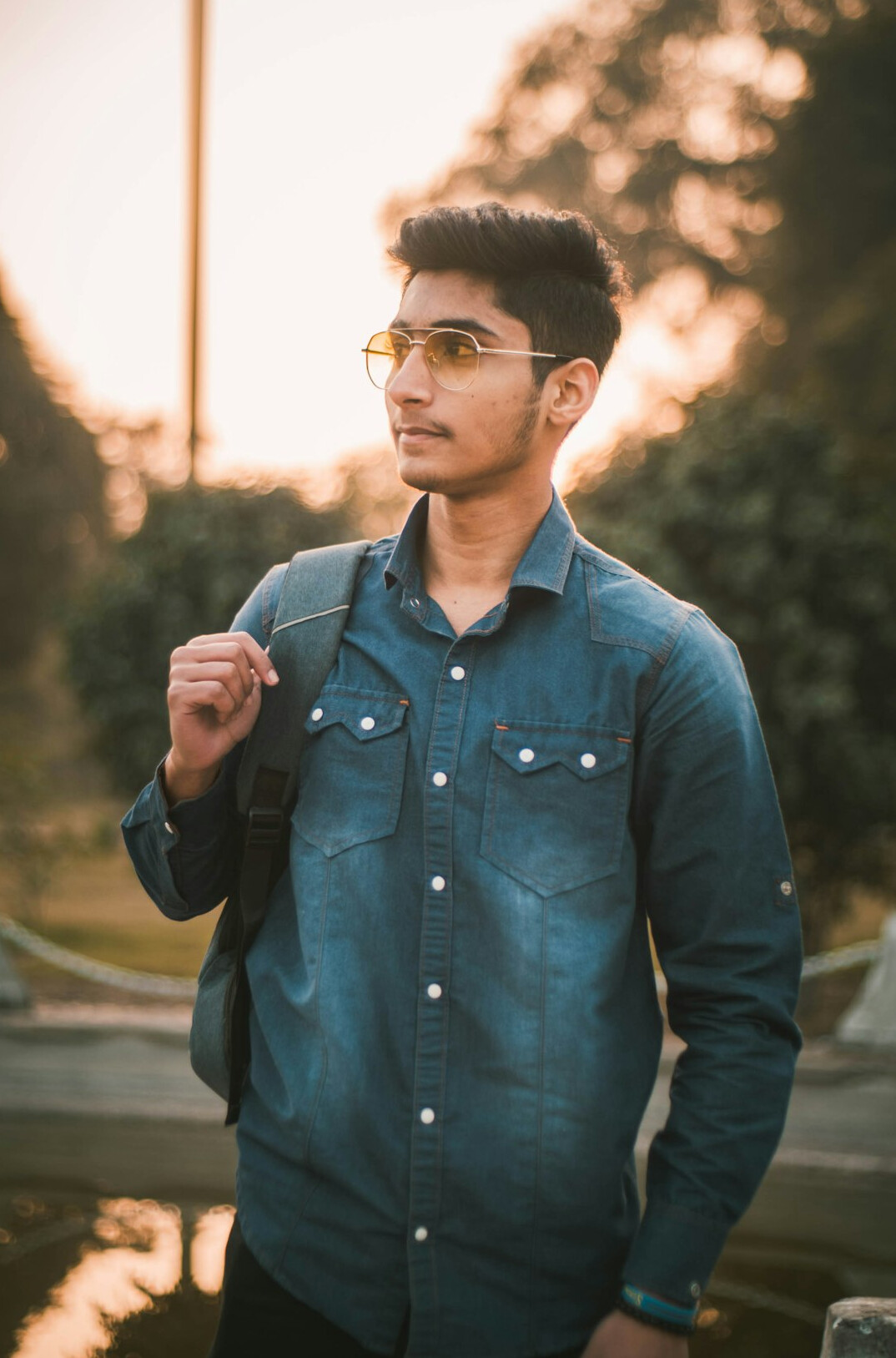Portrait of a young man with glasses in a shirt