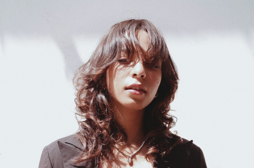 Portrait of a smiling woman with long brown hair