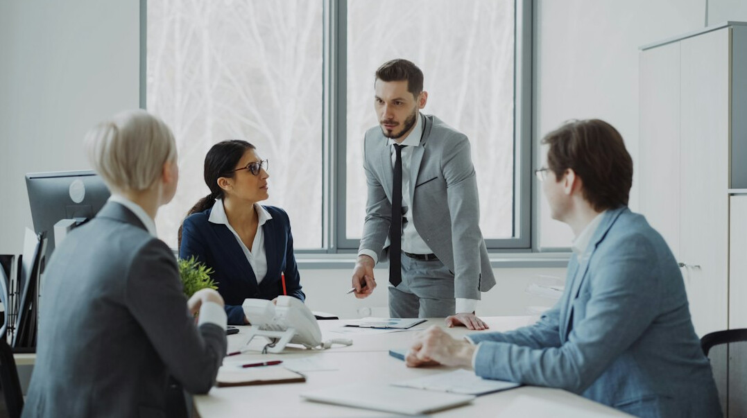 manager leading team meeting